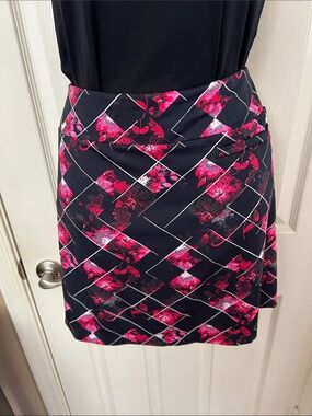 Tail Black Mini Golf Skirt with Fuchsia Floral Geometric Print